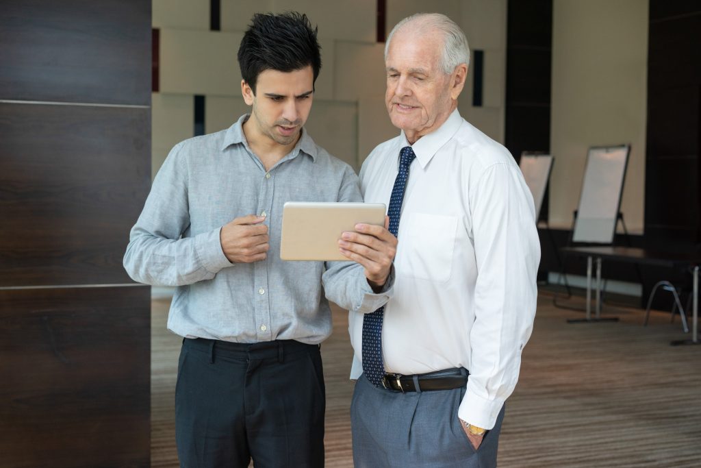 business-team-discussing-data-tablet (1)