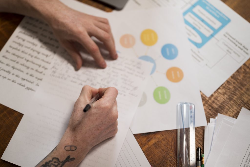 close-up-young-man-writing-virtual-classroom