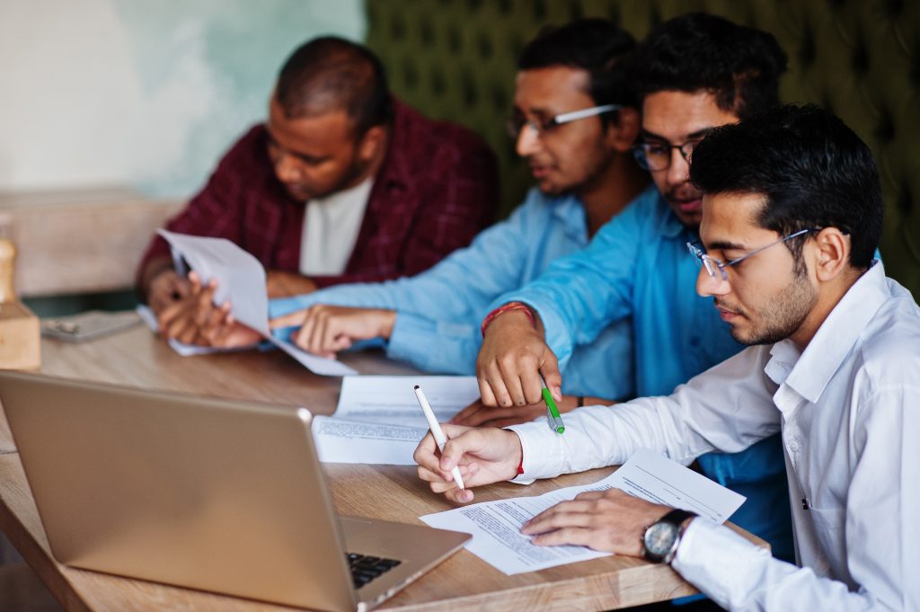 Group of four south asian men's posed at business meeting in caf tnpsc Study materials